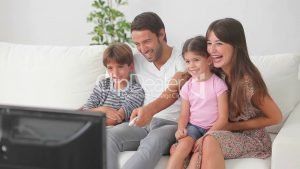 6--2258602-happyfamilywatchingtelevision-happy-family 3